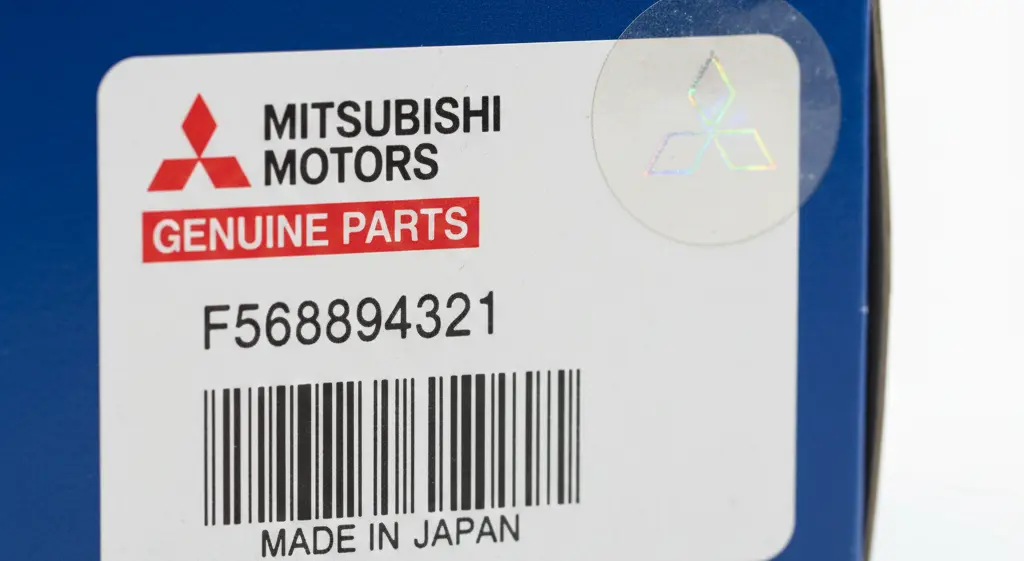 Original Mitsubishi spare parts packaging with barcode and security seal