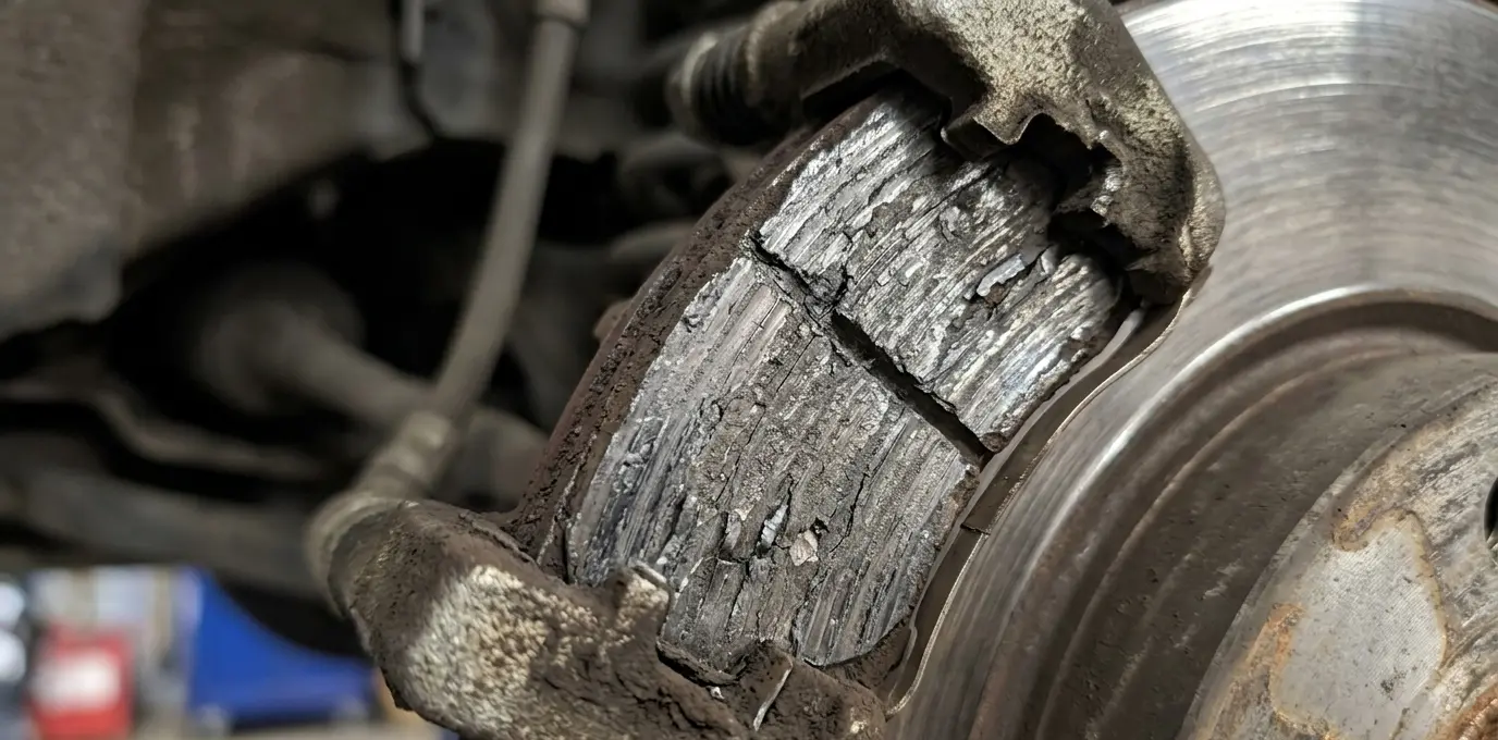 brake pad, worn car parts, Mitsubishi repair signs